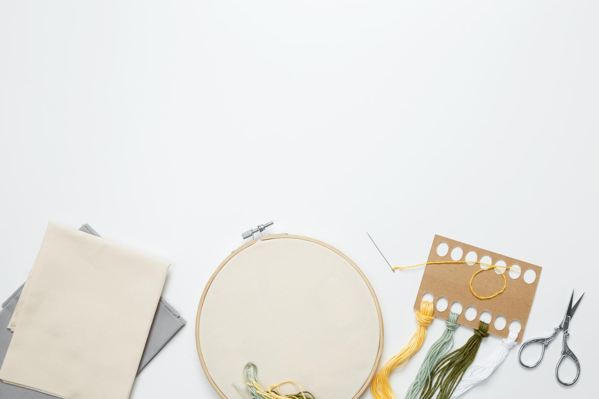 Assortment of embroidered goods on white table